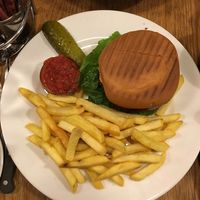 Veggie Burger- veganized! They replace the mayo with hummus and swap out the brioche. Still very tasty! at The Laundromat Cafe in Reykjavik
