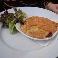 Souffle Pancake [£10.50] – Garlicky spinach, red onion marmalade, Camembert & Stilton cheese wrapped in crepe with chervil and dill souffle topped with lentil, tomato, ginger sa at Sky Apple Cafe in Newcastle Upon Tyne
