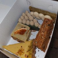 Lemon tart, carrot cake, something with matcha, pistachio, peanut butter bar at Elli's Healthy Specialities in Crete