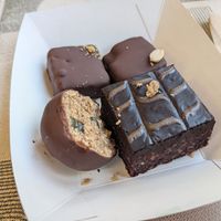 Brownie, chocolate peanut butter ball, Dubai chocolate and Snickers at Elli's Healthy Specialities in Crete