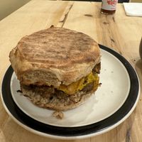 Vegan breakfast sandwich with everything (English muffin with vegan sausage, vegan egg, vegan cheese).  at Common Crumb in Troy