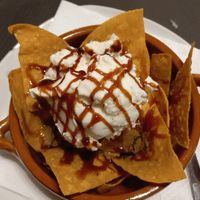 Oat milk ice cream with fried tortilla chips & caramel sauce at Mamalupe Arcos in Arcos De La Frontera