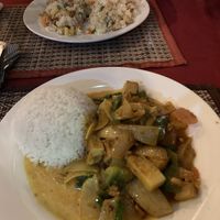 Curry and fried rice dish in the background   at Lemongrass Bistro in Kampot