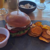Lentil vegan burger: greasy bun, bland patty, and flavorless sides. at La Casona in San Pedro De Atacama