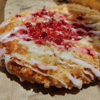 Dessert pastry topped with local berries at Backstube Tromsoe in Tromsoe
