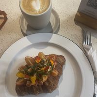 Home made almond milk flat white and tofu filled croissant  at Casa Nueza in Buenos Aires
