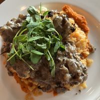 Presentation was beautiful. It’s carrot purée on the bottom, yellow split peas, cauliflower with mushroom gravy   at Main Deck in Penn Yan