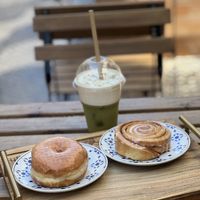 Original glazed and cinnamon bun with iced matcha latte   at Scoop 'n Dough in Cascais