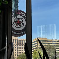 Sign at the entrance showing park across the street  at Pow Pow - I St NW  in Washington