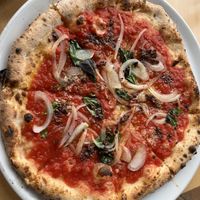 Pizza with onion and olive toppings  at La Terrazza in Hakone