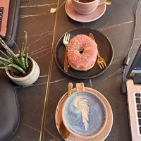 Breakfast tea, vegan donut 🍩, and butterfly 🦋 latte with oat milk   at Pink Zebra in North London
