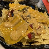 Nachos veggie: Nachos, verduras, queso veggie y salsa veggie   at Hamburguesería Crónicass in Ciudad Real