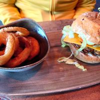 Vegan cheeseburger w/ courgette patty and onion rings at Le Burger in Innsbruck