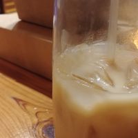 Iced coffee called Yo Soy Amor with my leftovers and an extra meal for tomorrow (Eggplant parm over spaghetti squash) called Eternally Youthful. at Cafe Gratitude in Kansas City