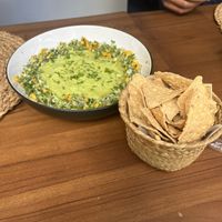 This guac was HUGE and so good we got two more baskets of chips!  at Good Karma  in San Salvador