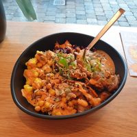 Custom bowl with vegan chicken, peanut hummus, and curry cauliflower. at Funkybowl Medienhafen in Dusseldorf