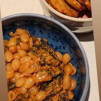 Boiled peanuts with collard greens. Side of plantains.  at Kann in Portland