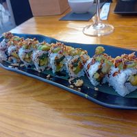 Avocado, mango, cucumber, crispy onion, sesame seeds, and teriyaki sauce at Tropiqual in Sevilla