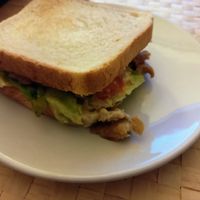 Vegan faux chicken sandwich with vegan mayo and veggies at The Vegan Gipsy - Cloud Kitchen in Sevilla