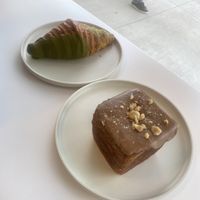 Matcha Croissant 🥐 and hazelnut chocolate croissant. This place has the flakiest croissants ever!   at To Live For in Vancouver