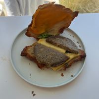 vegan sausage croissant breakfast sandwich open at To Live For in Vancouver