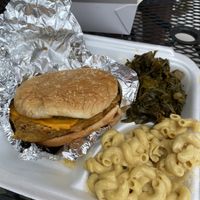 Chickpea burger with Mac and cheese and collard greens  at Convenient Vegan in Cleveland