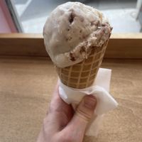 Single scoop of chocolate espresso martini in a waffle cone  at Creamery X in Toronto