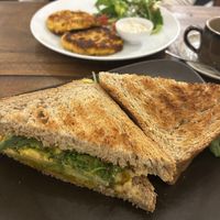Chickpea fritters and toasted pumpkin, avocado, hummus sandwich  at The Muffin Man in Siem Reap