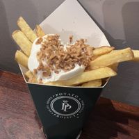 Chips with vegan truffle sauce and crispy onion   at Potato Project in Lisbon