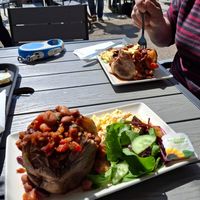 A regular favourite. Jacket potato with chilli beans, salad and vegan slaw.  Delicious. at Crofters Cafe in Truro