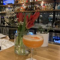 Full bar with passion fruit cocktail  at True Food Kitchen in Edison