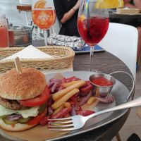 Veggie burger with colourful fries at Cat Cafe in Vilnius
