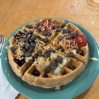 Vegan waffle with fruit toppings, toasted coconut, vegan custard, and vegan chocolate chips  at The Waffle Lady in St Johns