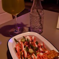 Fried corn with truffle mayo and pink wasabi mayo next to a mocktail at Let‘s be Frank in Vienna