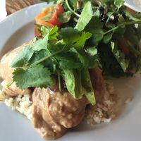 Gluten-free vegan pan-fried tempeh with roast sweet potato, avocado, peanut sauce, chutney and salad at One Earth Cafe in Willoughby