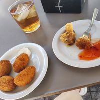 Mosto, croquetas y saquitos de cebolla caramelizada y avellanas at La Vegatería in Salamanca