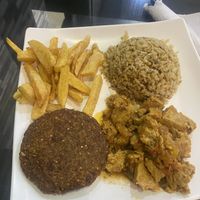 Arroz integral + gluten (seitán en salsa) + croqueta + papas  at Vital in Santa Marta