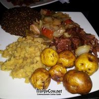 Lunch plate at Vital with yellow lentils, yellow potatoes, fake ham, and falafel. at Vital in Santa Marta