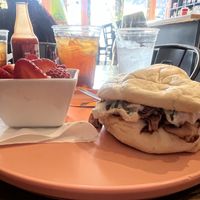 BBQ Jackfruit Sammy (featuring vegan coleslaw!) with fruit side.  at Blue Moon Cafe in Fayetteville
