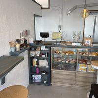 Order counter with a selection of (non-vegan) donuts  at Klatch Coffee in Ishigaki