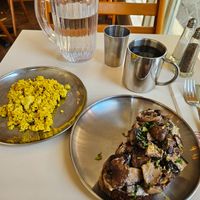 Cashew cream and mushrooms on toast with a side of tofu scrambled eggs at Sunday to Sunday in New York City