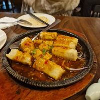 Sizzling tofu in house special saucee  at Tofu Vegan - Spitalfields in East London