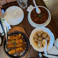 Sizzling tofu, wontons, and silken tofu in savory sauce at Tofu Vegan - Spitalfields in East London