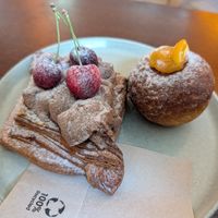Cherry danish and puffy ball filled with orange filling. at KŸNO in Brno