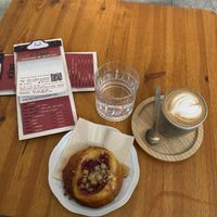 Koláč with raspberries and pudding + flat whitee  at KŸNO in Brno