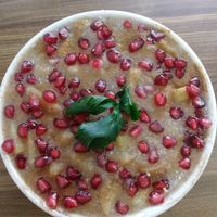 Porridge stew (not oatmeal). Slightly sweet. Pomegranate, apple, cinnamon, coconut. at Sat Saheb in Kathmandu