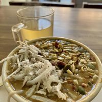 Fresh power pudding (small size) and herbal tea (large size)  at Sat Saheb in Kathmandu