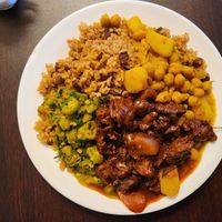Citrus 🐔, chick pass and chana, rice and peas, calaloo and okra at Starving Vegan in Brooklyn