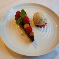 Dark Chocolate and Olive Oil Tart, Honeycomb Ice Cream, Raspberry. at Hotel Portmeirion & Castell Deudraeth in Gwynedd