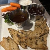 Boneless chkn wings- sauce on sides -don’t be scared of how they look 😅 they were delicious!  at Picazzo's Organic Italian Kitchen in Sedona